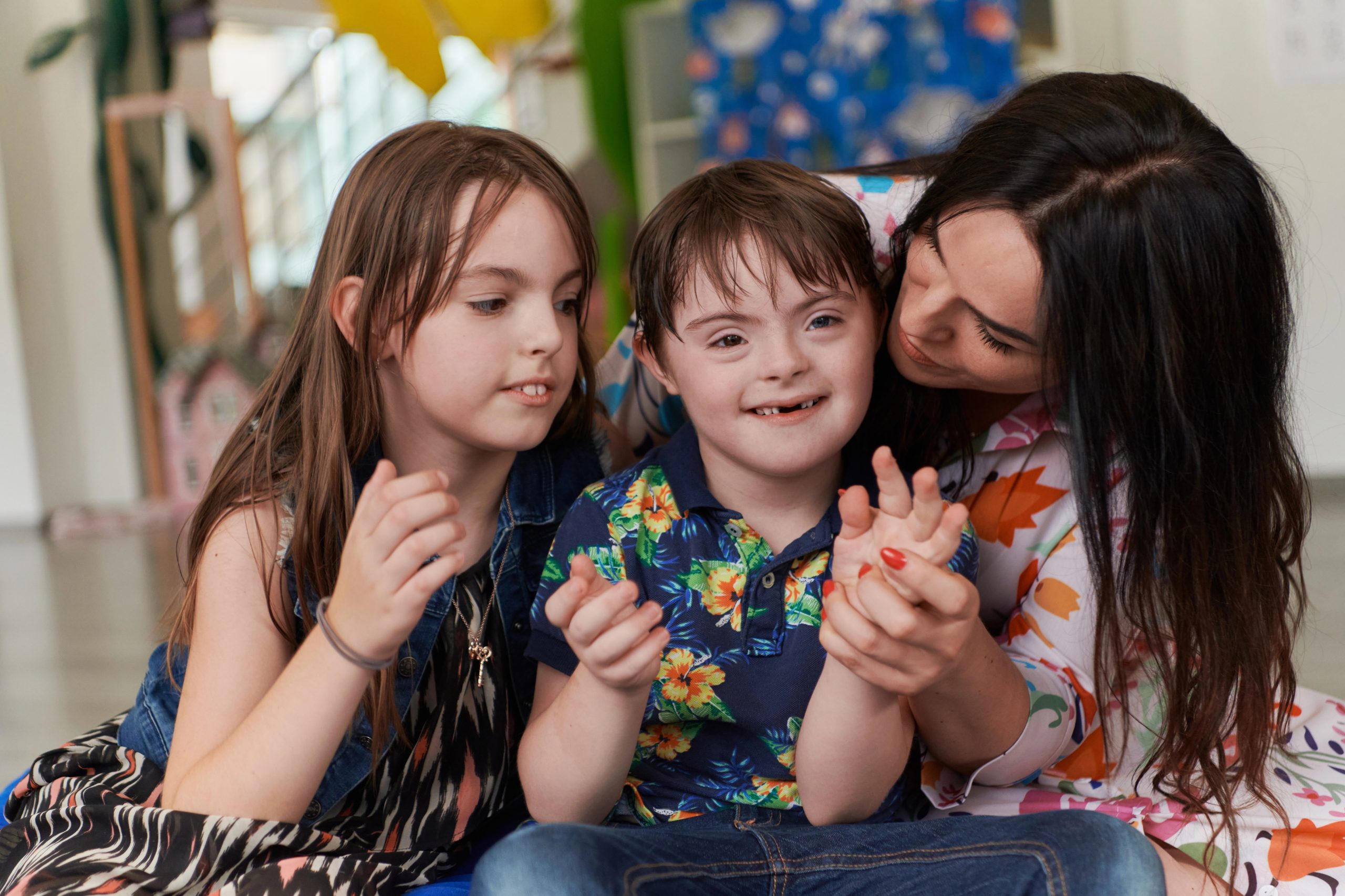 Mother interacting with a child with Down syndrome